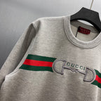 Light gray Gucci sweatshirt with ribbed crew neck and striped logo graphic detail