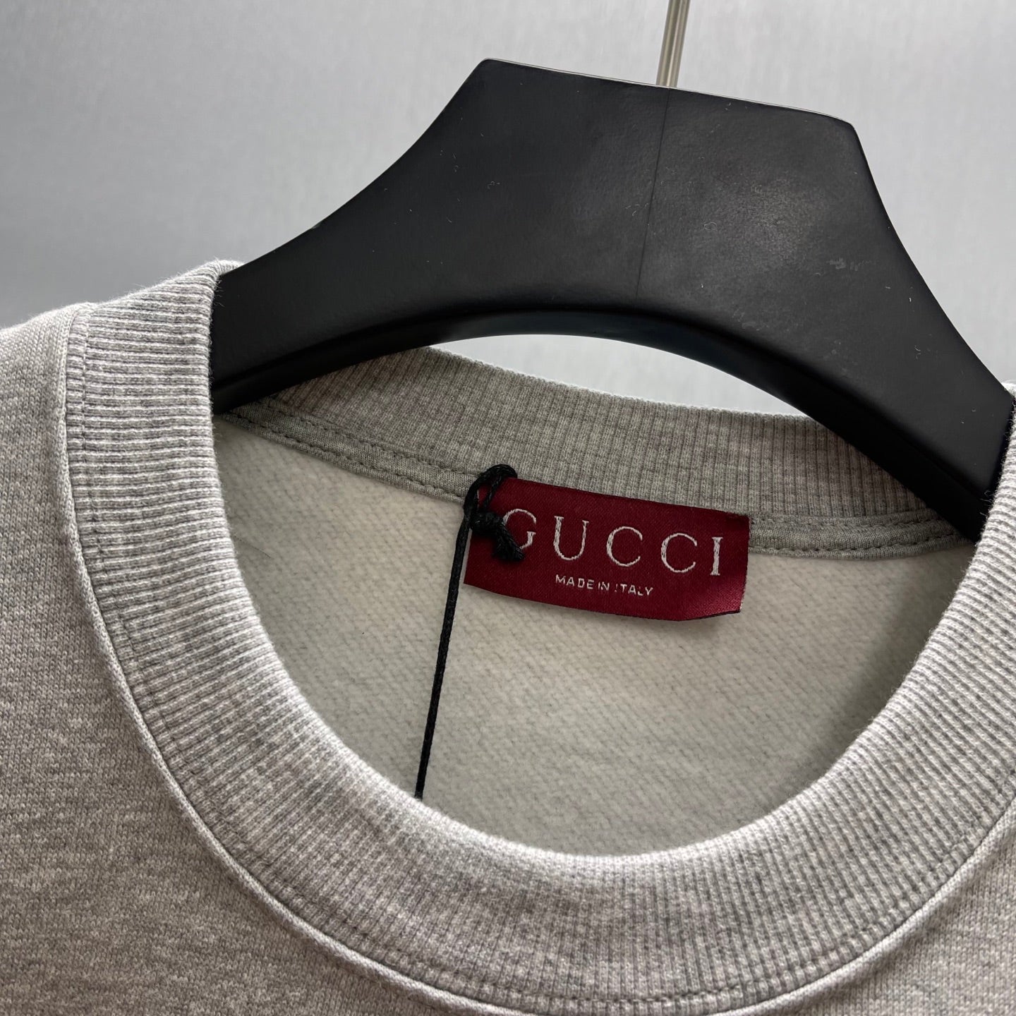 Light gray Gucci sweatshirt crew neck with interior size tag at collar