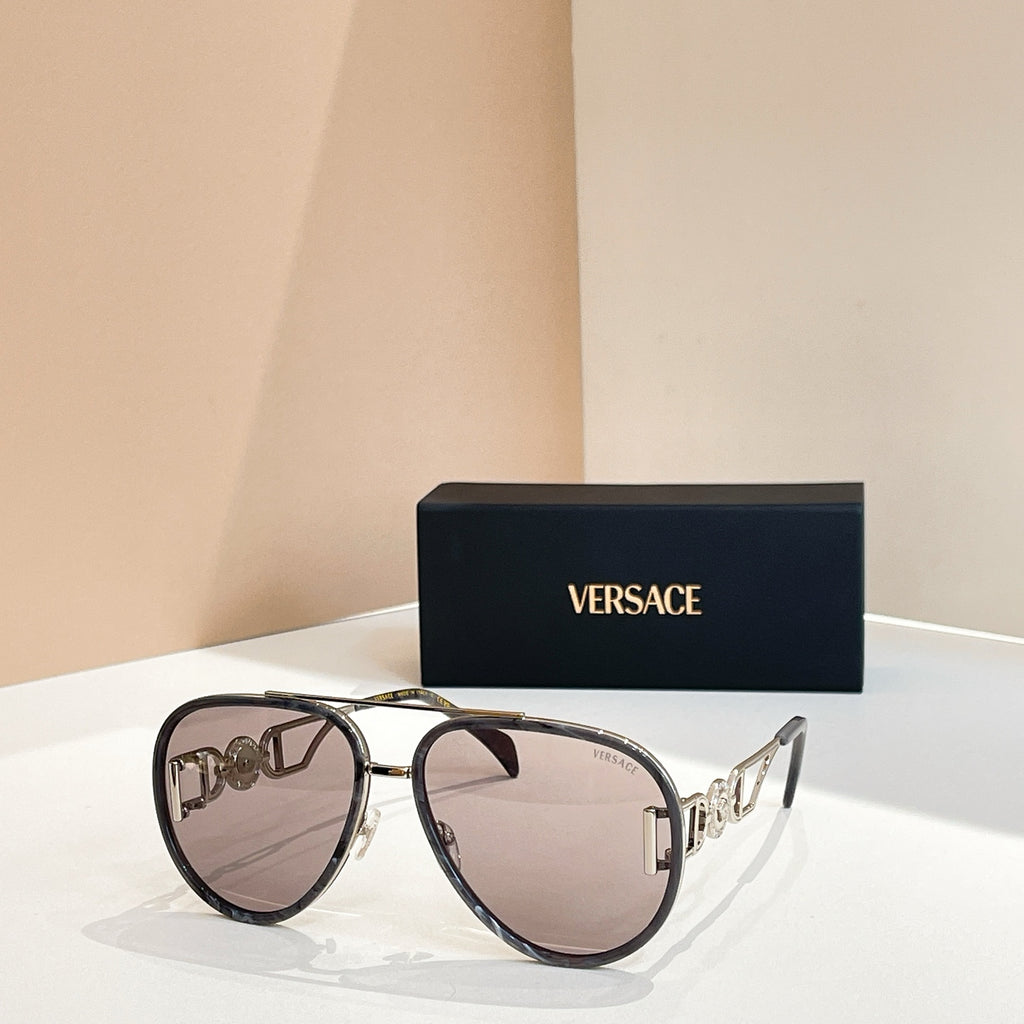 Versace sunglasses with black frames and rose-tinted lenses