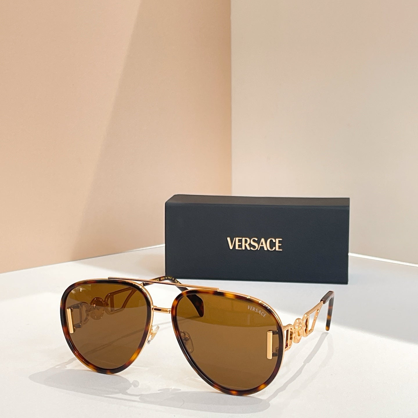 Versace sunglasses with tortoiseshell frames and amber-tinted lenses
