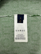 Care label inside green patterned top; size S, Italy; dry clean instruction