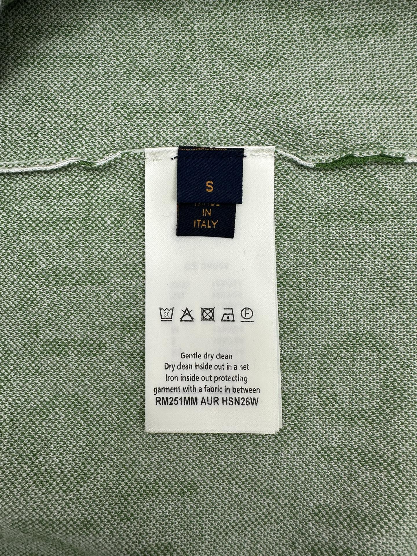 Care label inside green patterned top; size S, Italy; dry clean instruction