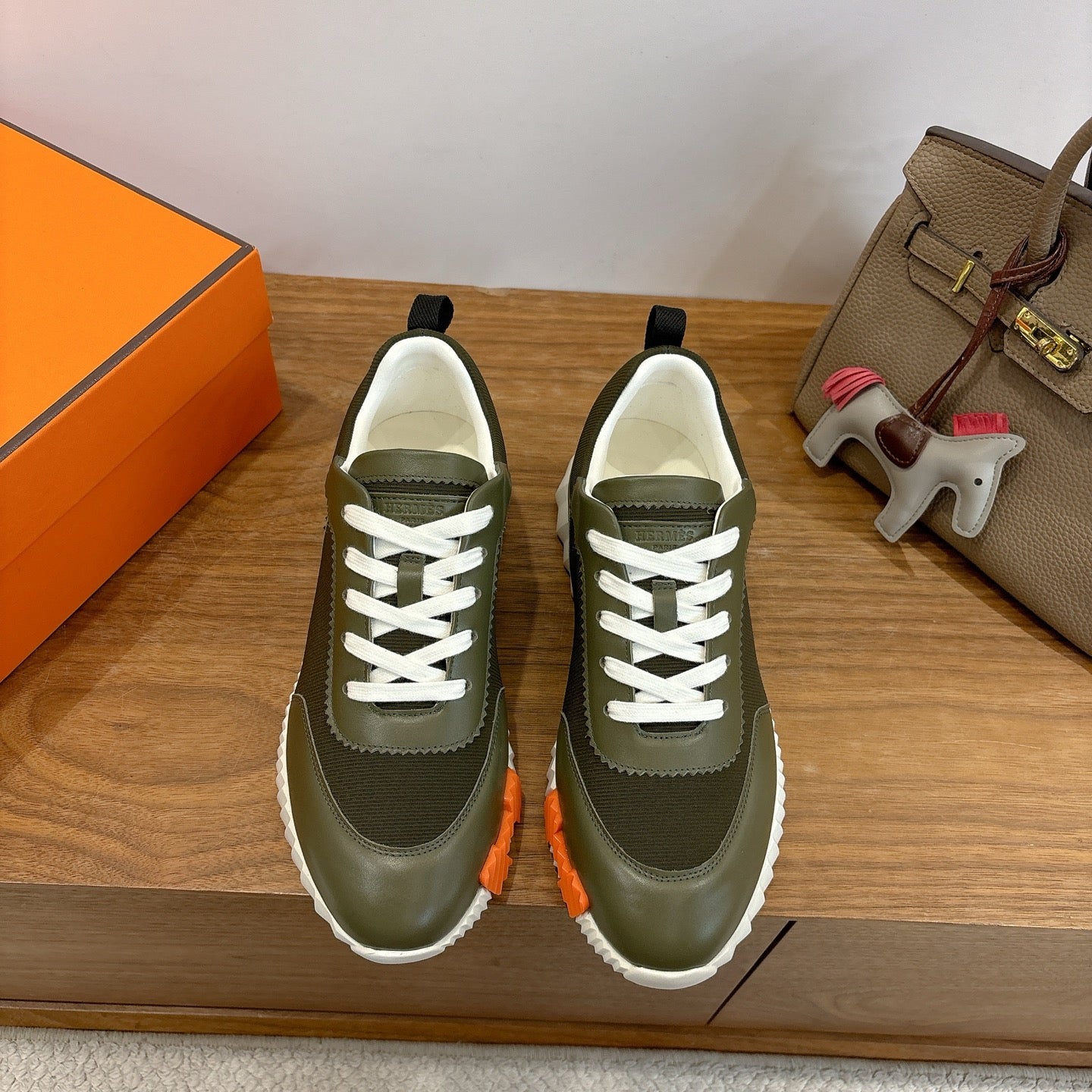 Hermes unisex sneakers in olive green with white laces and thick white sole