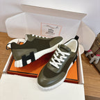 Hermes unisex sneakers, olive green with white laces, scalloped trim, chunky sole
