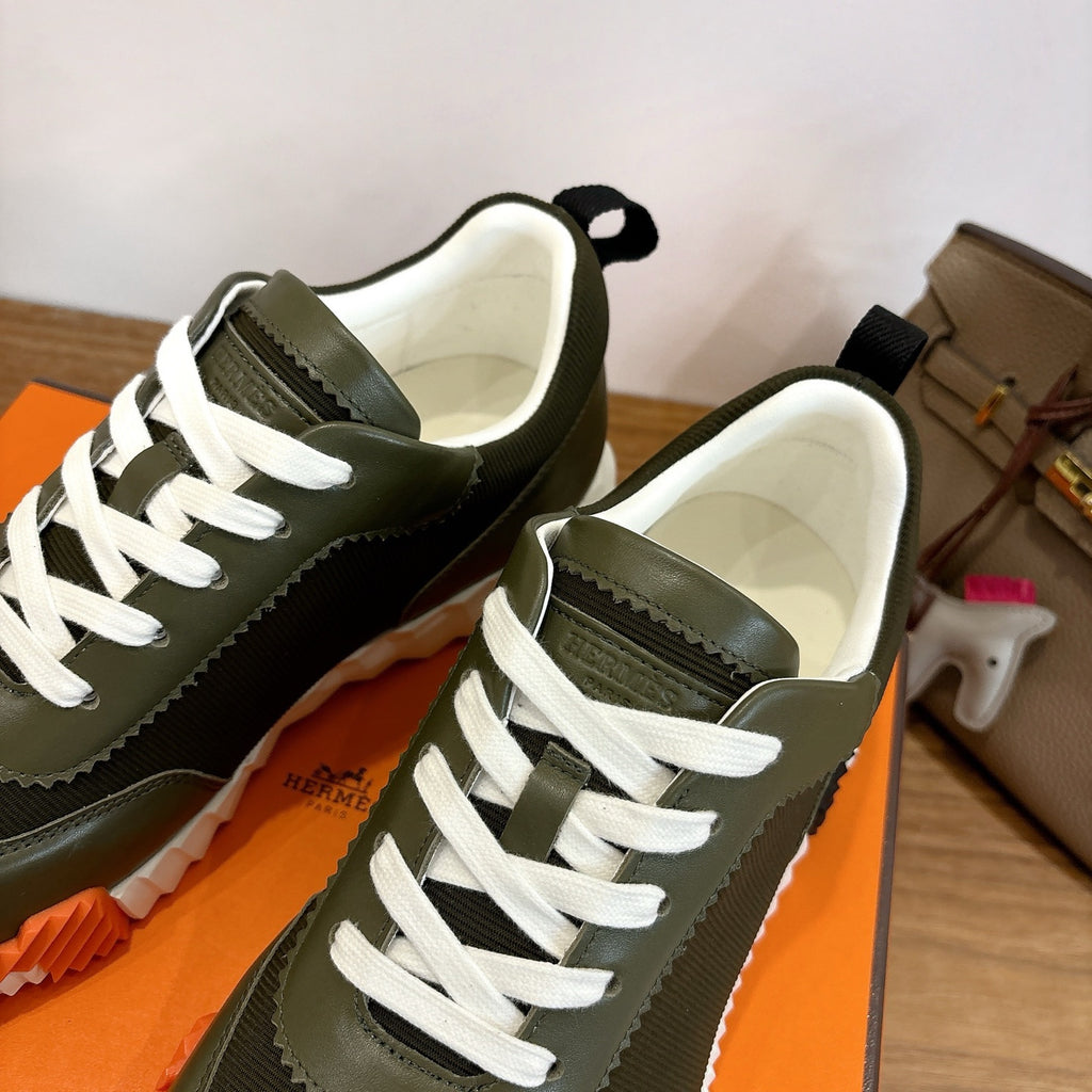 Unisex sneakers pair in olive green with white laces and contrasting thick sole