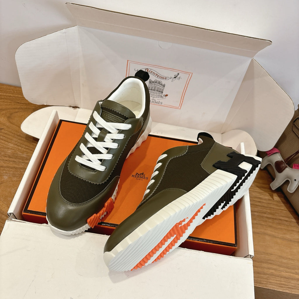 Unisex sneakers, olive green uppers with white laces and chunky white midsole