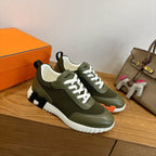 Unisex sneakers in olive green leather with white laces and textured chunky sole