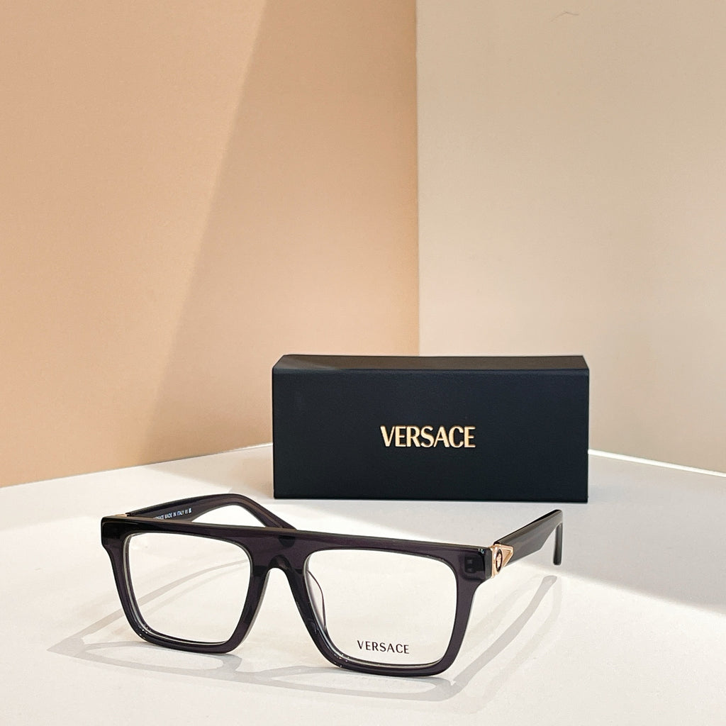 Versace eyeglasses with black rectangular frames, clear lenses, and gold accents.