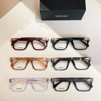 Assorted Versace eyeglasses, multiple colors: red, black, amber, and clear purple frames.