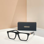 Versace eyeglasses with black rectangular frames and gold hinge accents.