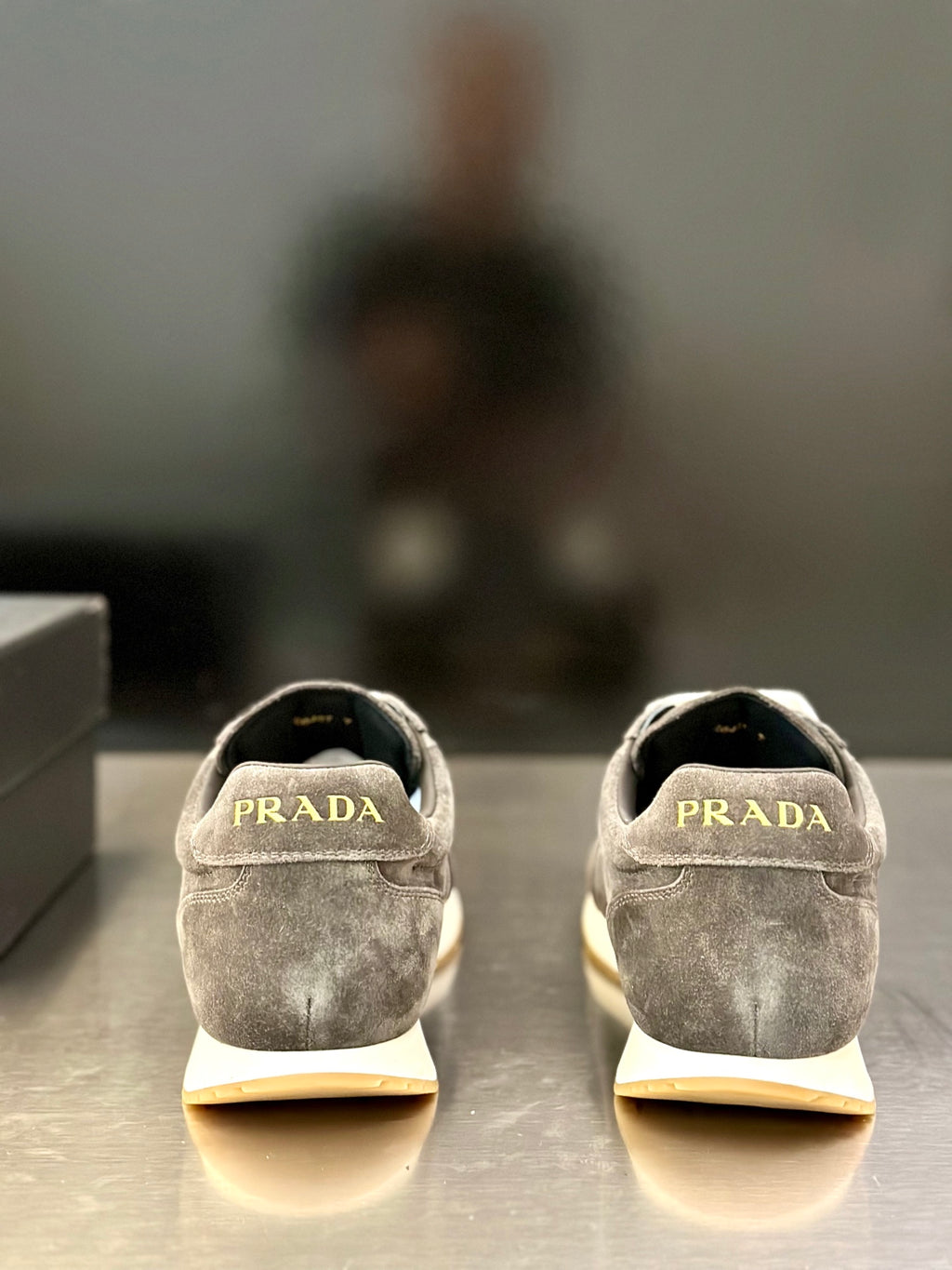 Prada unisex lace-up sneakers, dark gray suede back view with heel logo detail