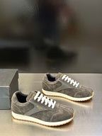 Prada unisex lace-up sneakers, dark gray suede with white laces and rubber sole