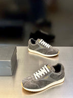 Prada unisex lace-up sneakers, dark gray suede with white laces and light rubber sole