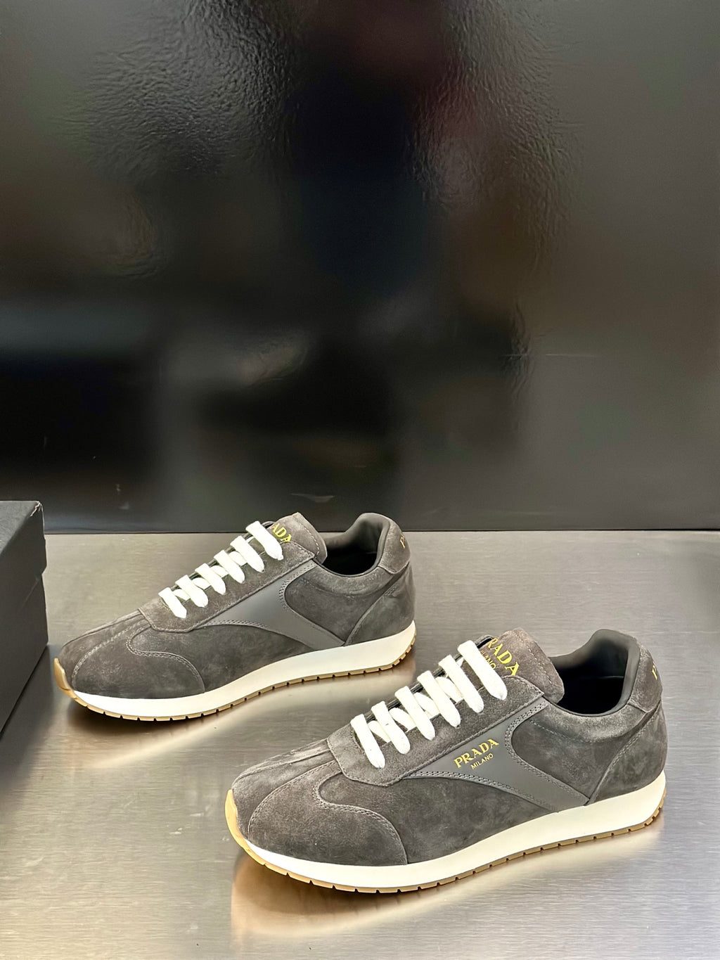 Prada unisex lace-up sneakers, dark gray suede uppers with white laces and tan trim