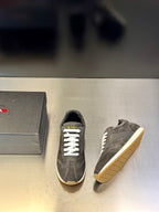 Prada unisex lace-up sneakers, dark gray suede with white laces and light sole