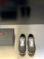 Prada unisex lace-up sneakers, dark gray suede with white laces and logo on tongue
