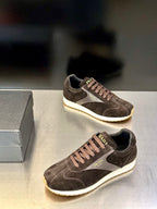 Prada unisex sneakers in dark brown suede with white sole and side logo panel.