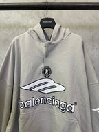 Light gray button-front hoodie with hood, front emblem and large Balenciaga logo