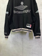 Black Balenciaga hoodie with front logo, crest, and striped cuffs and hem