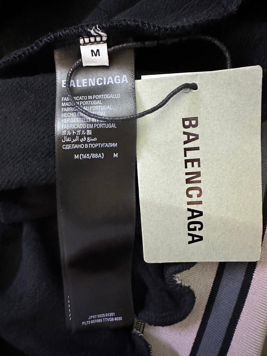 Black Balenciaga hoodie size tag and fabric label inside collar