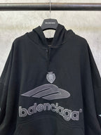 Black Balenciaga hoodie with front crest emblem, hood and kangaroo pocket
