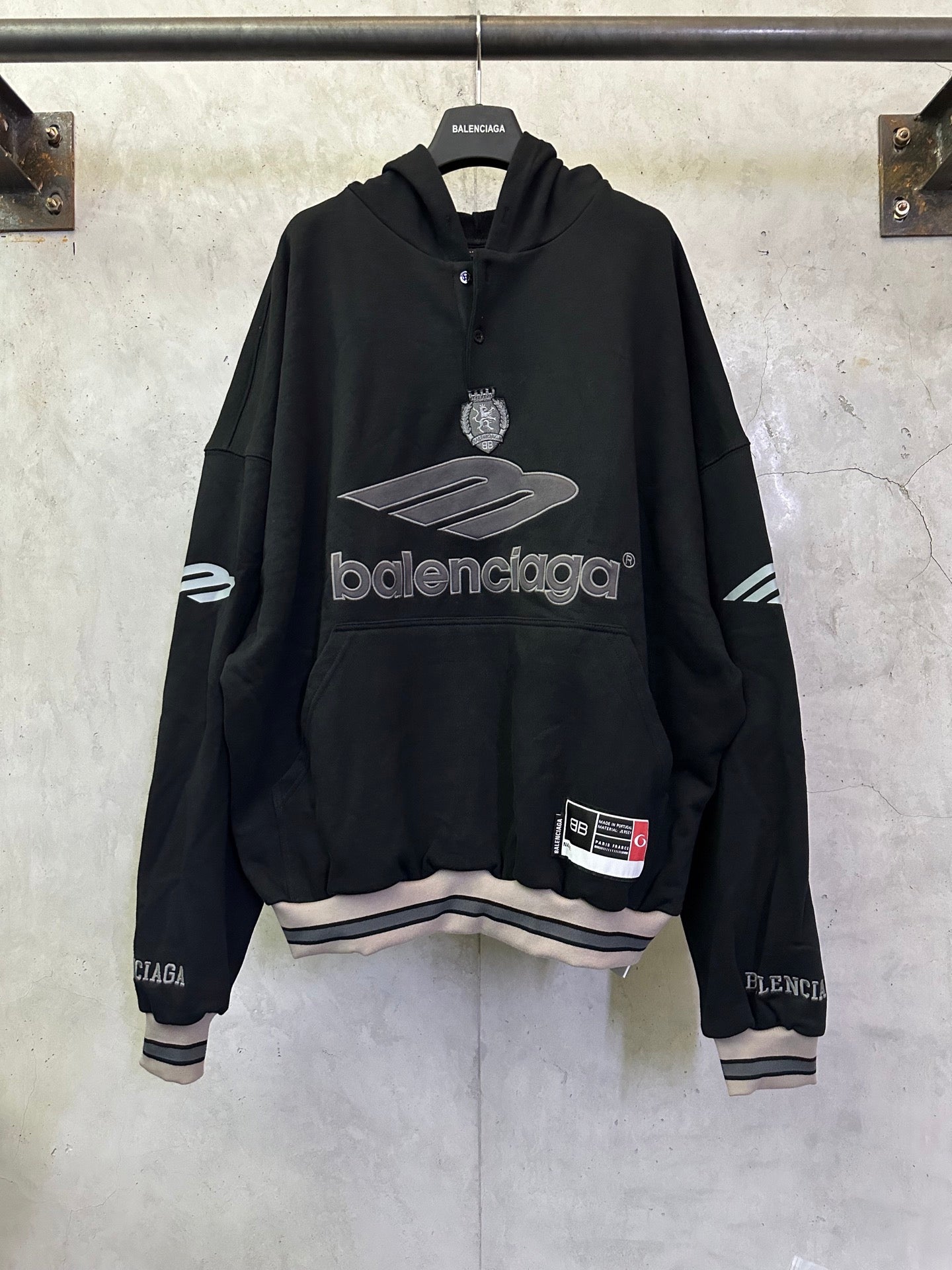 Black Balenciaga long-sleeve hoodie with large front logo and hood