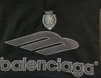 Black Balenciaga hoodie front close-up showing crest and large logo text