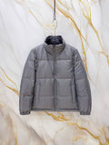 Gucci long puffer jacket in dark gray, hooded with full front zipper and quilted panels.