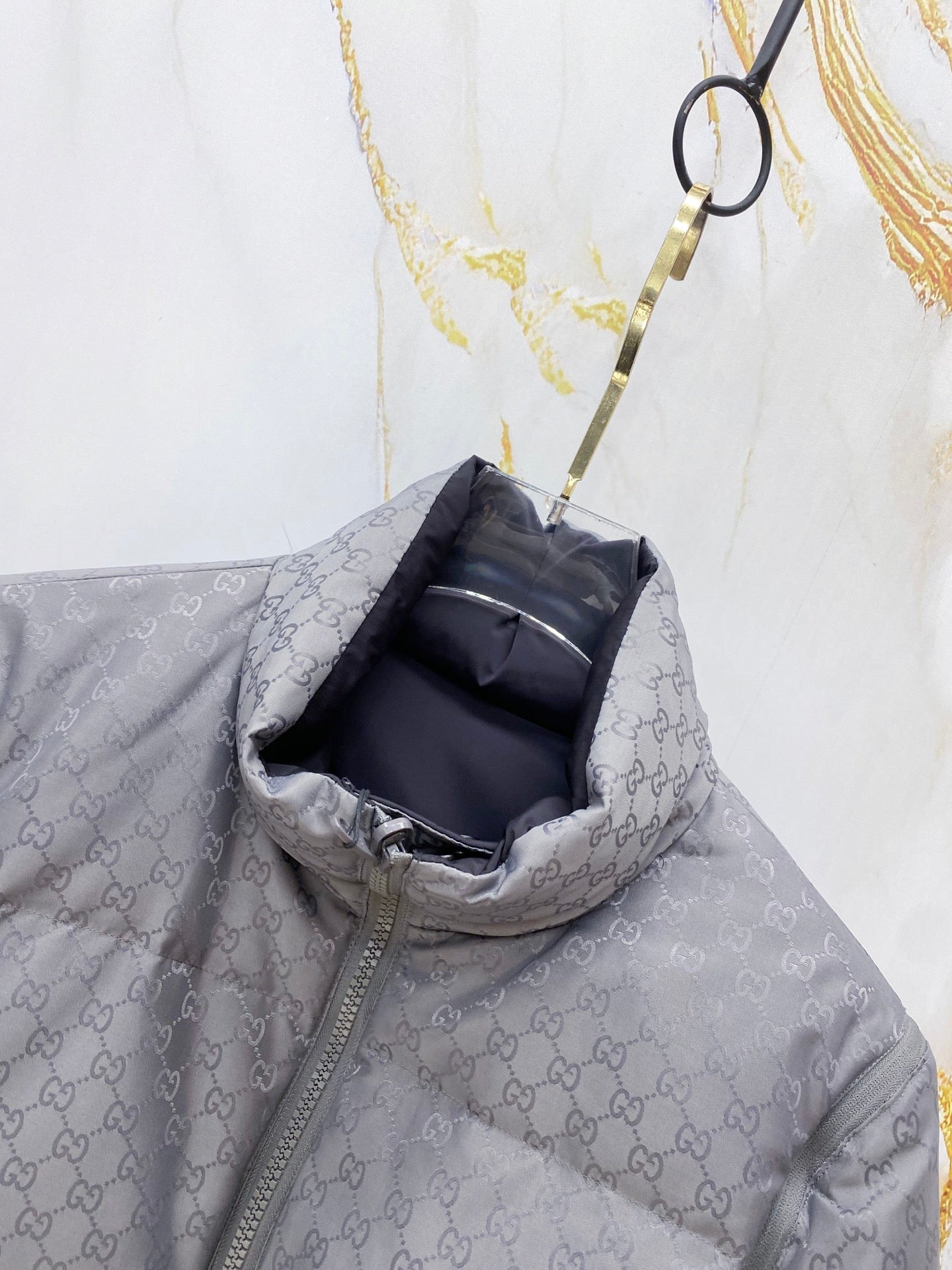 Gucci long puffer jacket collar opening with hood lining, dark gray GG monogram fabric.