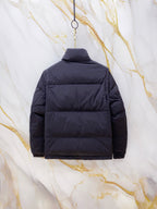 Gucci long puffer jacket in navy blue, back view with hood and horizontal quilting.