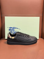 Dark leather lace-up sneaker with black laces and patterned collar lining