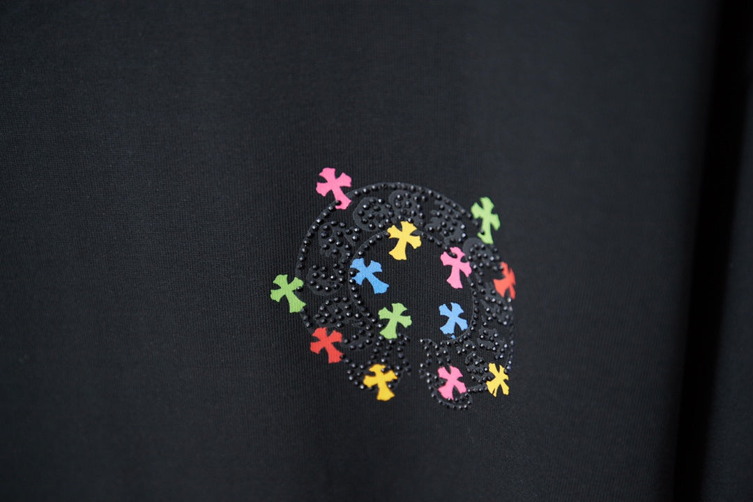 Black T-shirt with rhinestone-look circular multicolor cross-style graphic
