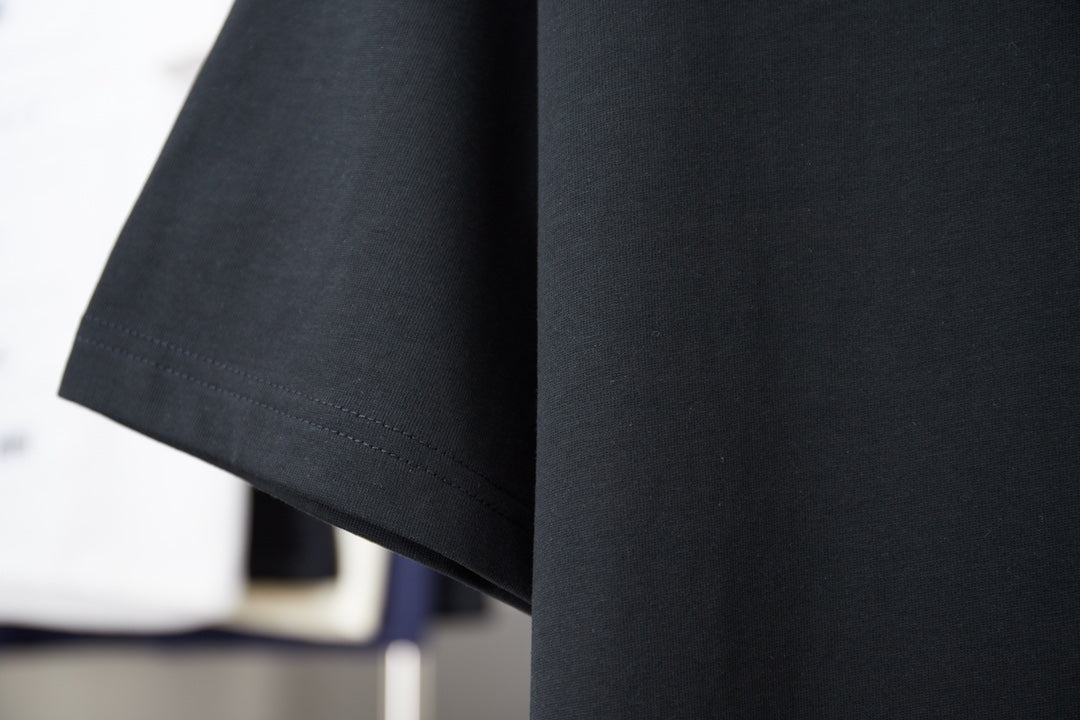Black short-sleeve T-shirt with clean stitched side hem and curved bottom