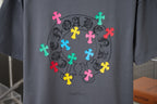 Gray crew-neck T-shirt with large multicolor cross circular emblem