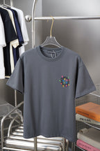 Gray crew-neck T-shirt with small multicolor cross graphic on chest