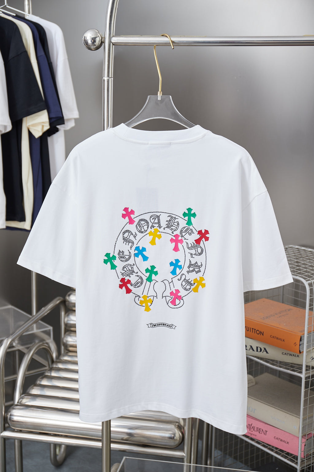 White graphic T-shirt with large circular multicolor cross print on back