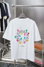 White graphic T-shirt with large circular multicolor cross print on back