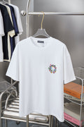 White graphic T-shirt with small circular multicolor cross logo at left chest