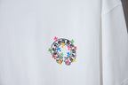 White graphic T-shirt with circular multicolor cross design on front