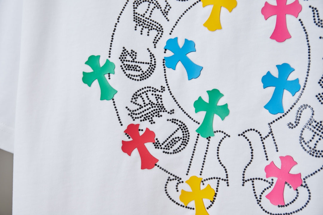 Close-up of multicolor cross graphic on a white T-shirt
