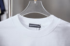 Chrome short T-shirt collar closeup with ribbed neckline and inside tag