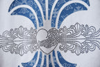 Chrome short T-shirt graphic closeup, blue ornamental crown motif