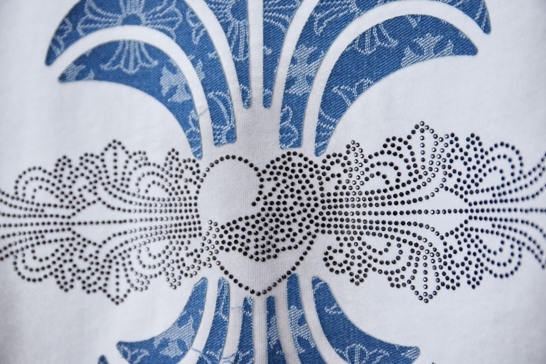 Chrome short T-shirt graphic closeup, blue ornamental crown motif