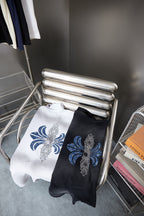 T-shirt pair with blue fleur-de-lis prints on white and black short sleeves