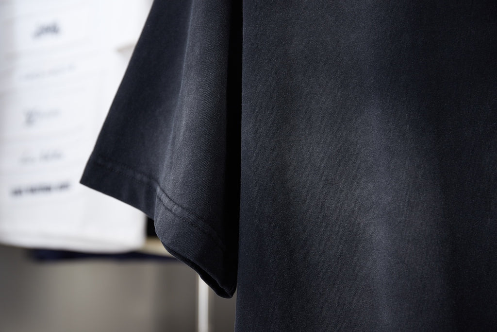 Black T-shirt side and hem view with short sleeves