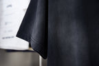Black T-shirt side and hem view with short sleeves