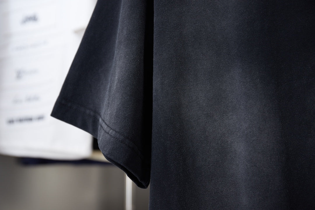 Black T-shirt side and hem view with short sleeves