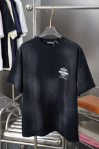 Black short-sleeve crewneck T-shirt with white-blue fleur-de-lis chest graphic