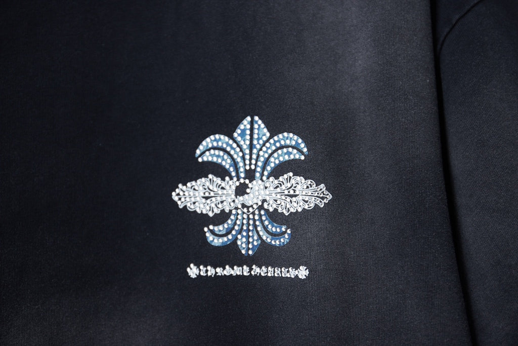 Black T-shirt with centered fleur-de-lis design in blue and white
