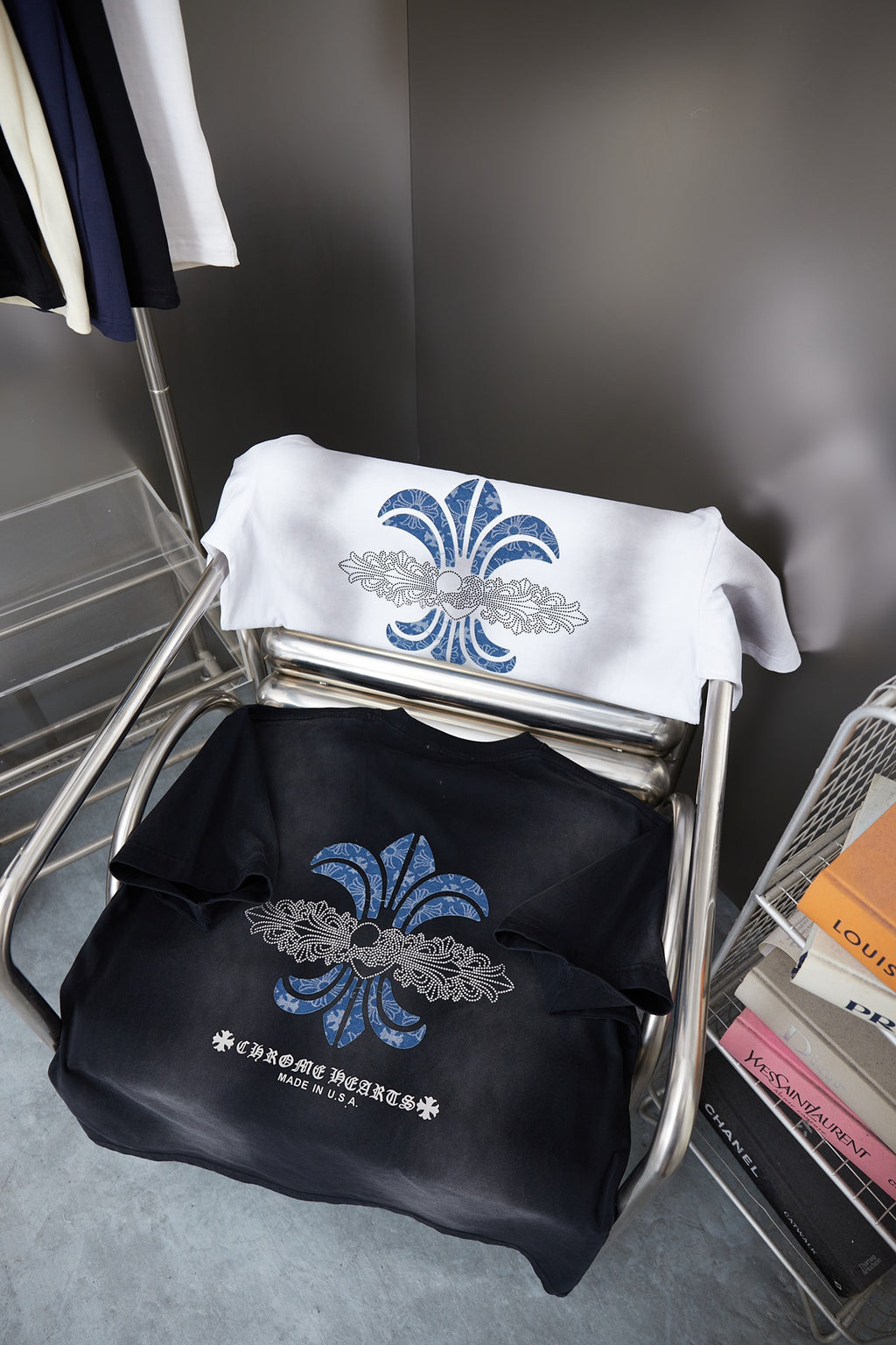 T-shirt pair with blue fleur-de-lis prints: white shirt and black shirt